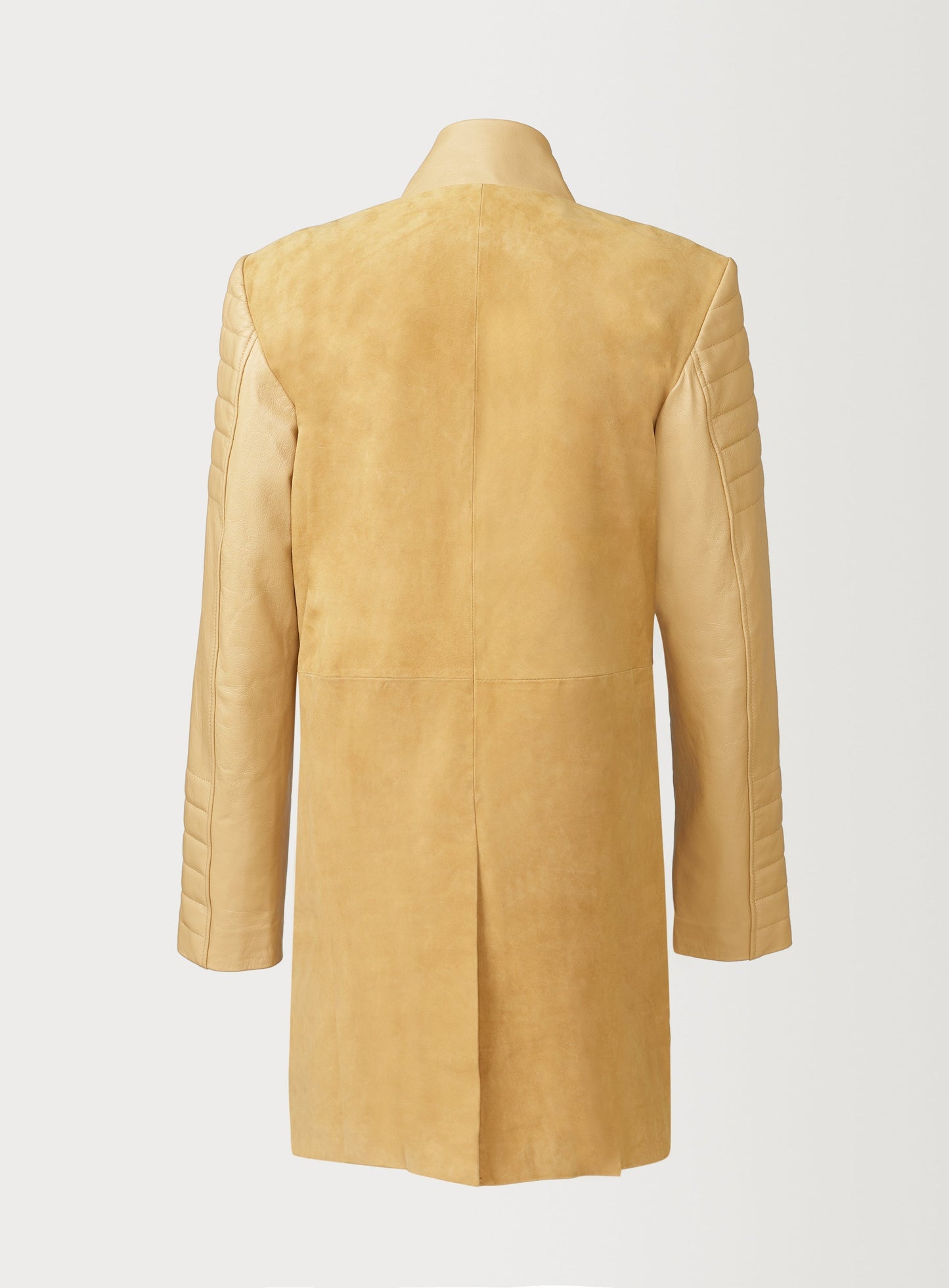 A Beautiful Suede Trench Coat, created by designer brand PRSVR. The PRSVR Lab Coat has a suede Body, and lambskin leather sleeves that show off a padded ribbed design on the shoulder and wrist of the sleeve. 